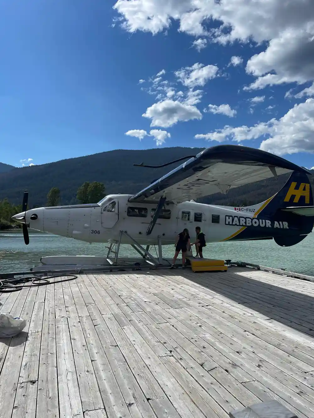 The floatplane on the dock with the mountains behind