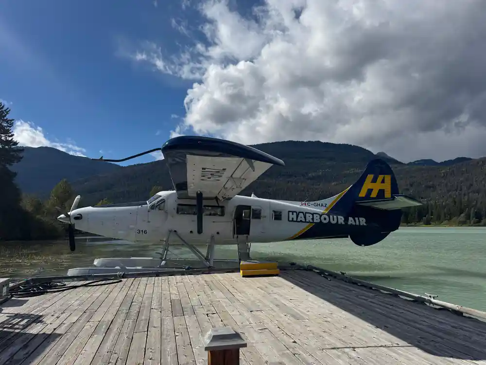 The floatplane tied up at the dock on a clear day