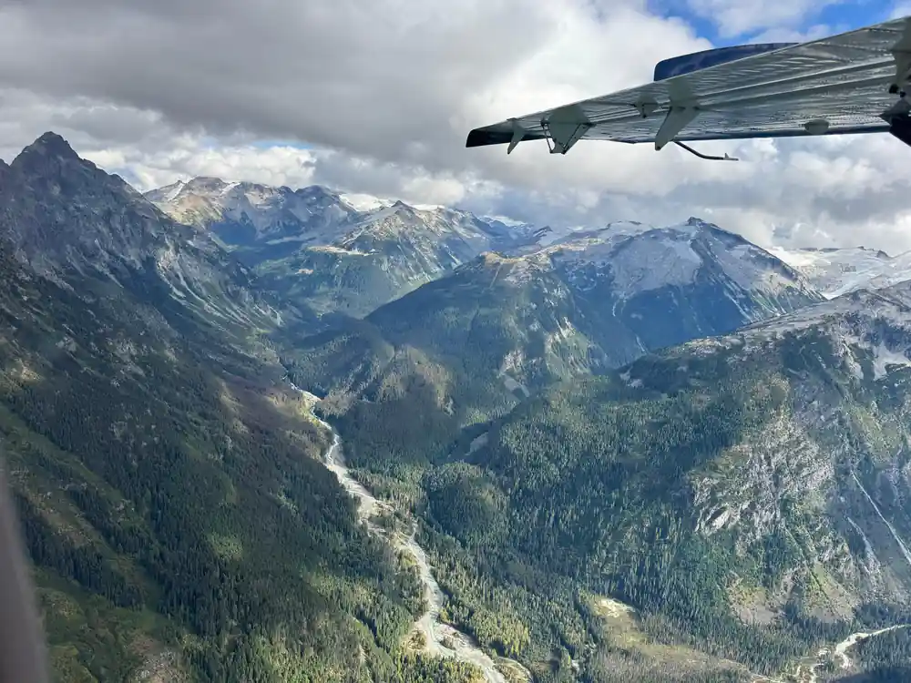 Forested mountains falling away to a valley floor