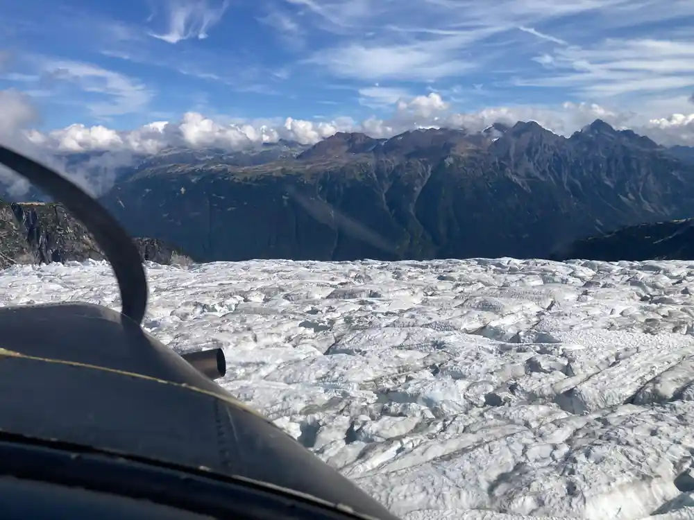 A glacier seen over the aircraft nose
