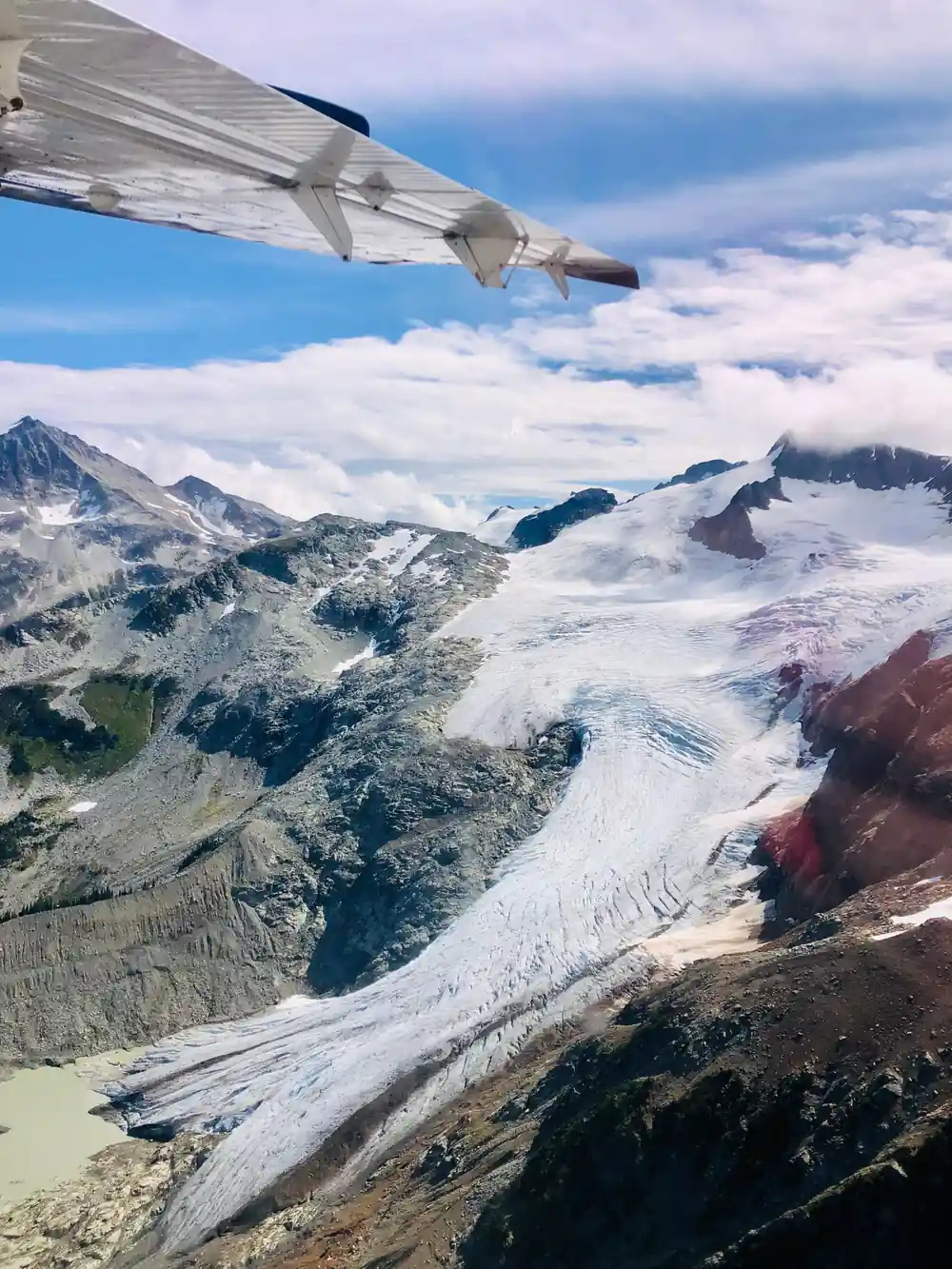 A glacier tongue running down between rock walls