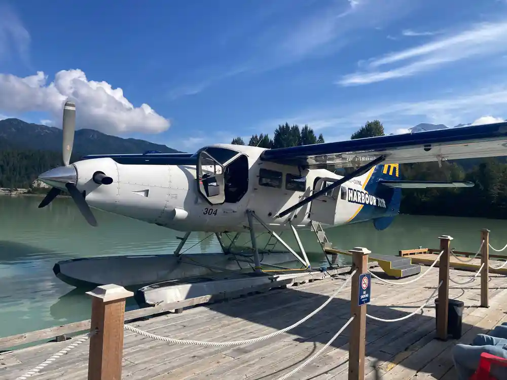 A Harbour Air floatplane on its floats at the dock