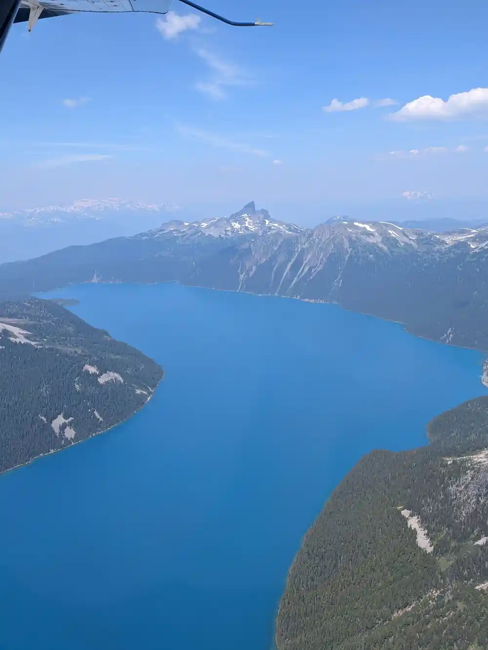 Long blue lake with the Black Tusk standing on the horizon