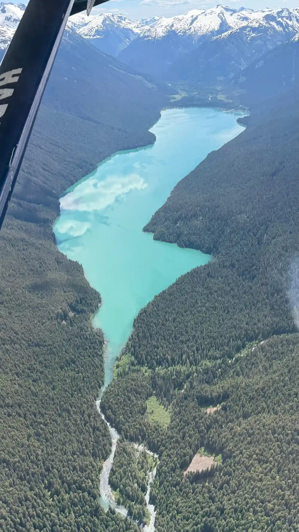 A long narrow lake running between steep slopes