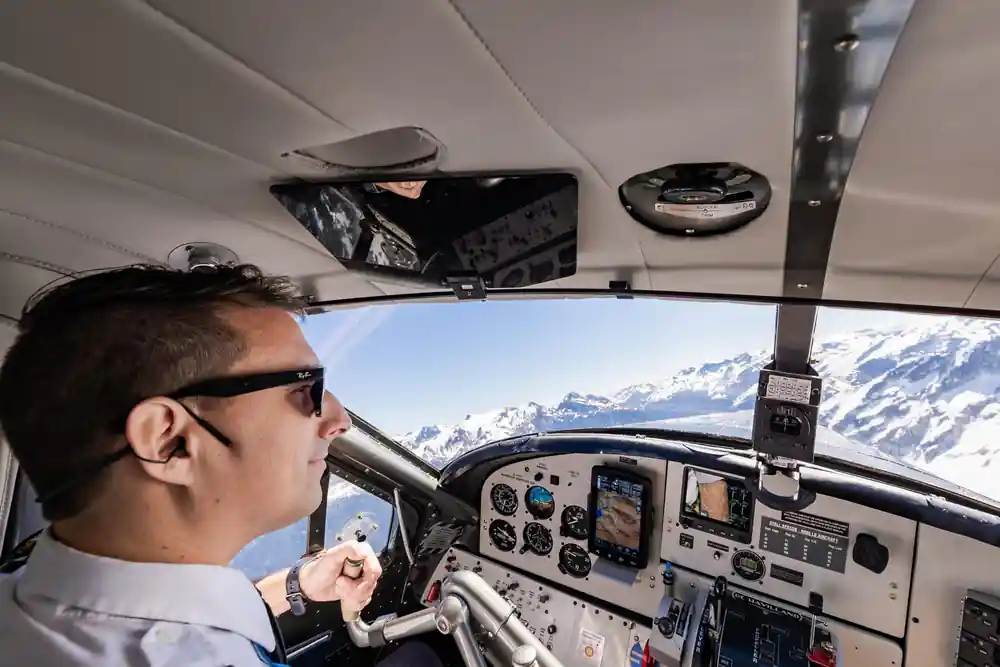 The pilot at the controls of the floatplane