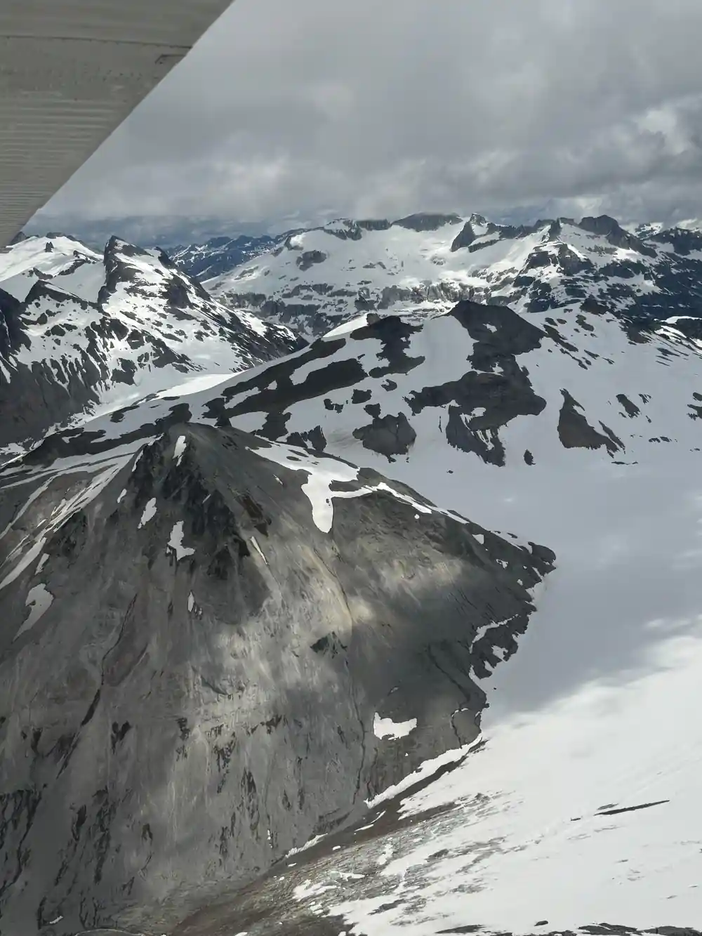 Snow and bare rock on a high summit